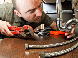 Man performing plumbing repairs